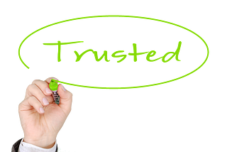 hand writing trusted in green letters