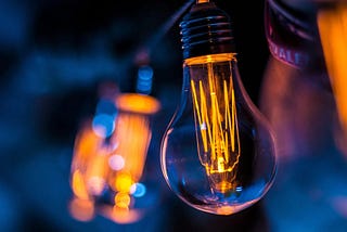 Edison light bulbs against a blue background