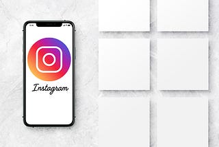 A phone with Instagram on the screen next to blank white blocks