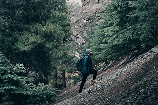 Man on a steep hill looking up