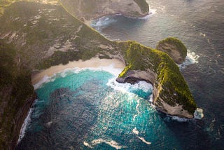An aerial view of a mountainous shoreline