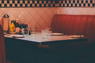 Red vinyl booth at a neighborhood diner