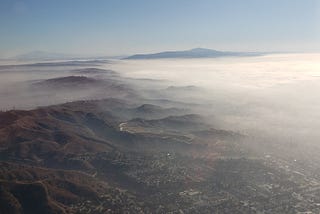 Morning fog spread along mountain range
