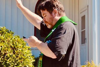 A priest praying outdoors on a sunny day