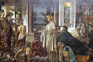 A group of Athenian revelers gather in a house to drink and discuss philosophy, the original meaning of the word ‘symposium’.
