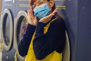 A designer working in a laundromat