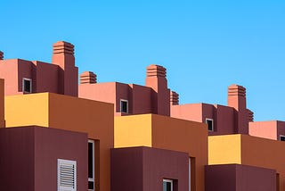 Brown and Yellow Concrete Building Under Blue Sky