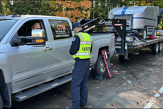 Pennsylvania Division Safety Investigator Michael Appolonia speaks with a driver during the I-90 HotShot Initiative.