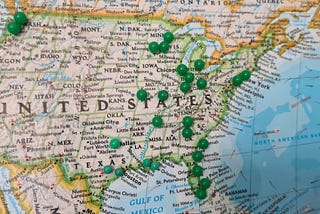 A map of the United States with push pins in different locations showing a planned trip