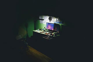 an image of two computer monitors on a desk to represent a hacker’s work station where they might conduct data breaches.