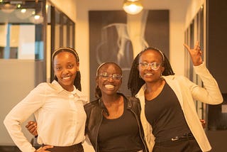 Three ladies who are mentees of KamiLimu mentorship program in Kenya posing for a picture