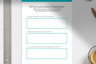 A sheet of paper on a white surface, aligned perfectly with a metal ruler on the left side. The worksheet has the title “3 Procrastination Questions” and space for the user to write down their answers.