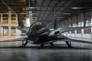Futuristic biplane in an aircraft hangar