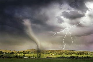 A tornado and lightning hitting a village
