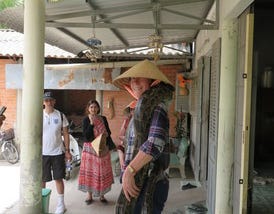 Pet python draped on my shoulders in Vietnam