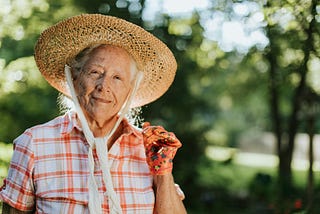 Happy senior woman with strawhat