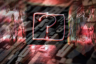 Blocks of letters and numbers overlaid with a neon question mark and graffitied walls