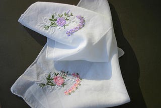 Two embroidered handkerchiefs