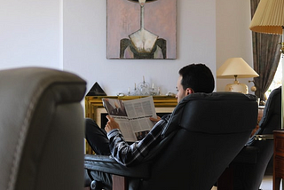 After Long Day of Sitting at Home, Man Looking Forward to Sitting at Home in Different Chair