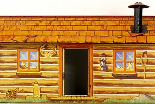 A small cabin from a Marx Western playset with an open door and two small windows on each side plus a chimney on the top right. The parts of the cabin are painted, so the roof tiles are a rustic brown and the logs are painted light and darker browns.