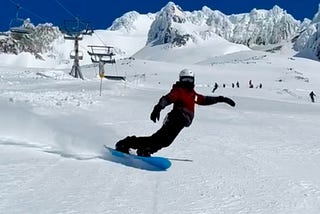 Author leans into a turn on his snowboard on Mt. Hood in Oregon