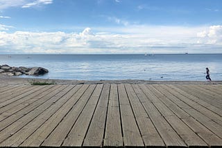 View of a boardwalk facing Lake Ontario.