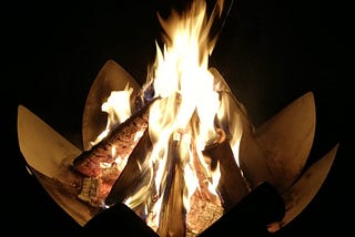 bonfire in a lotus form of metal