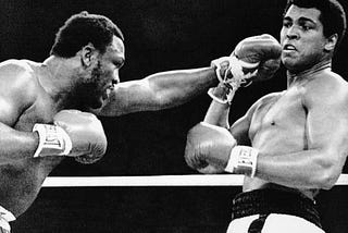 Joe Fraizer punching Muhammad Ali