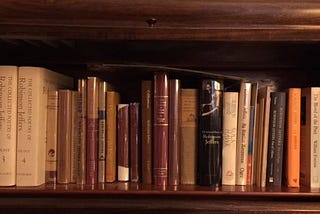 Top shelf of lawyer glass-fronted bookcase.