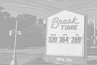 A manual (non-digital) Break Time primary fuel price sign.