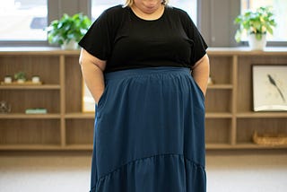 A fat woman smiling with joy.