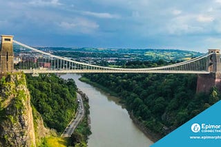 Photo looking over the River Avon and the Clifton suspension bridge in Bristol with a decorative accented bright blue triangle in the bottom right with the Epimorphics connecting data logo and www.epimorphics.com link in white.
