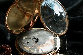 Photo of a restored gold pocket watch.