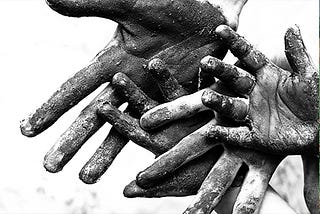 Dirty worker hands symbolizing labor abuse