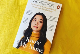 A copy of Know My Name by Chanel Miller against a mustard background.