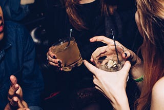 Girls Drinking — Photo by Michael Discenza on Unsplash
