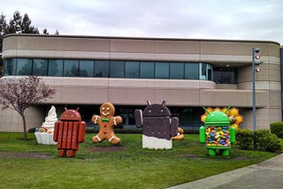 A photo of Android dessert sculptures celebrating Android OS releases in front of Google Building 44 in Mountain View, CA.