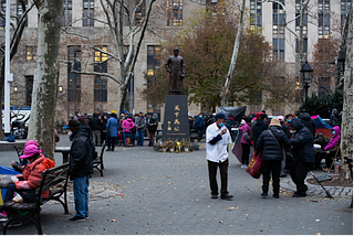 Chinatown’s Columbus Park is busying with elderly people playing traditional instruments, Chinese chess and gambling on December 5, 2021. A little rain in the late afternoon wouldn’t damp their spirits. By Yuning Li.