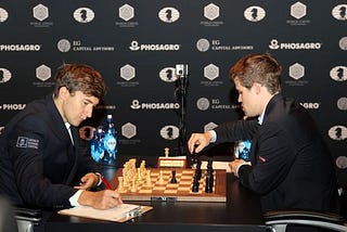 2 male players are playing chess at the World Championship