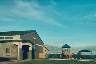 a church building with a playground