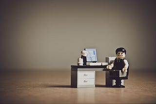 A LEGO character sitting in front of a PC from the medium blog of Federico Trotta