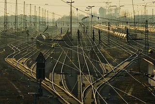 Branching train tracks and electricity wires