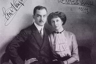 Ernst August in a dark suit and Viktoria Luise in a white blouse with layered cravat.