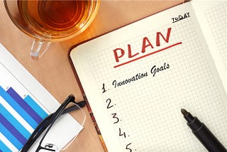 Picture of a paper planner with innovation goals.