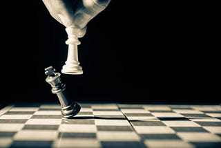 Image showing a chess board and symbolizes a player being defeated by the opponent.