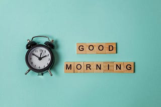 A whimsical alarm clock surrounded by cheerful ‘Good Morning’ signs, set against a lush green backdrop that screams vitality.