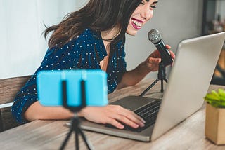 Young content creator, talking on mic for virtual event