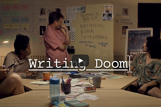 Four writers arranged around a table looking at the lead writer who are all perplexed about writing a TV season using Artifical SuperIntelligence as a good or bad actor