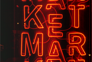 neon sign that says market, market, market