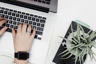 Hands typing on MacBook symbolizing best optimization practices